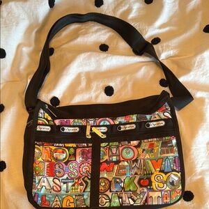 Shoulder Bags in Black with Spacious Interior and Adjustable Strap